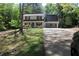 Charming two-story home featuring red shutters, a well-manicured lawn, and an attached two-car garage at 4314 Saddlecreek Ct, Auburn, GA 30011