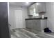 Updated kitchen features gray cabinets and floors at 4314 Saddlecreek Ct, Auburn, GA 30011