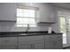 Grey kitchen cabinets with updated counter tops and sink at 4314 Saddlecreek Ct, Auburn, GA 30011