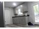 Updated kitchen features gray cabinets and floors at 4314 Saddlecreek Ct, Auburn, GA 30011