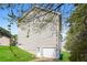 View of backyard featuring garage and grass at 5228 Kirk Dr, Atlanta, GA 30349
