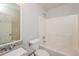 Bathroom with a granite countertop, white tub with shower at 5228 Kirk Dr, Atlanta, GA 30349