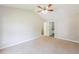 Spacious bedroom featuring a vaulted ceiling, ceiling fan, carpet, and ensuite bathroom at 5228 Kirk Dr, Atlanta, GA 30349