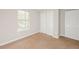 Cozy bedroom with a window, closet, and neutral carpet at 5228 Kirk Dr, Atlanta, GA 30349