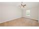 Vaulted ceiling bedroom with ceiling fan, carpeted floor and window at 5228 Kirk Dr, Atlanta, GA 30349