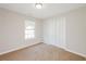 Bedroom featuring neutral carpet, a bright window and a large closet at 5228 Kirk Dr, Atlanta, GA 30349