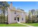 A view of the two-story home with siding and a well kept lawn and landscaping at 5228 Kirk Dr, Atlanta, GA 30349