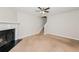 Bright living room with a fireplace and stairs to the next floor at 5228 Kirk Dr, Atlanta, GA 30349
