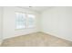 Bedroom boasts carpeting and bright natural light from two windows at 809 Brickleridge Se Ln, Mableton, GA 30126