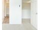 Spacious bedroom with neutral walls, plush carpet, and multiple doorways for easy access at 809 Brickleridge Se Ln, Mableton, GA 30126