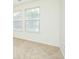 Bedroom boasts carpeting and bright natural light from two windows at 809 Brickleridge Se Ln, Mableton, GA 30126