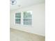 Sun-filled bedroom with neutral walls and carpet, plus a modern ceiling fan and updated window blinds at 809 Brickleridge Se Ln, Mableton, GA 30126