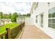 View from wood deck showcasing siding, green lawn and neighboring homes on a sunny day at 809 Brickleridge Se Ln, Mableton, GA 30126