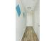 Bright hallway with minimalist wall decor leads to a white front door at 809 Brickleridge Se Ln, Mableton, GA 30126