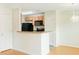 Functional kitchen with a breakfast bar, wood cabinets, and black appliances at 809 Brickleridge Se Ln, Mableton, GA 30126