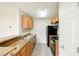 Galley kitchen features granite countertops, tile floors, and black appliances at 809 Brickleridge Se Ln, Mableton, GA 30126