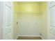 A bright laundry area features wooden floors, washer hookups, and a useful storage shelf at 809 Brickleridge Se Ln, Mableton, GA 30126