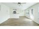 Open-concept living area flows into kitchen and dining area, with hardwood floors at 809 Brickleridge Se Ln, Mableton, GA 30126