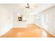 Bright and airy living room with hardwood floors, modern lighting, and a kitchen view at 809 Brickleridge Se Ln, Mableton, GA 30126