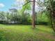 Expansive backyard with mature trees, offering privacy and ample space for outdoor activities at 2129 Fairhaven Ne Cir, Atlanta, GA 30305