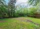 Sprawling backyard featuring lush greenery and mature trees, offering plenty of space at 2129 Fairhaven Ne Cir, Atlanta, GA 30305