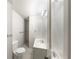 Bathroom featuring toilet, sink, towel rack, tile floor and lighting at 2129 Fairhaven Ne Cir, Atlanta, GA 30305