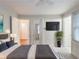 Relaxing bedroom with TV, plant, neutral tones and plenty of natural light at 2129 Fairhaven Ne Cir, Atlanta, GA 30305