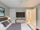 Calm bedroom featuring a TV and view of the kitchen through an open door at 2129 Fairhaven Ne Cir, Atlanta, GA 30305