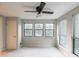 Bedroom featuring ceiling fan, three windows and carpet at 2129 Fairhaven Ne Cir, Atlanta, GA 30305