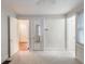 Neutral toned bedroom with carpet and multiple access doors to the rest of the house at 2129 Fairhaven Ne Cir, Atlanta, GA 30305