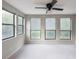Bedroom featuring ceiling fan, three windows and carpet at 2129 Fairhaven Ne Cir, Atlanta, GA 30305