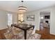 Tastefully decorated dining room with modern lighting, table setting and an adjacent living room at 2129 Fairhaven Ne Cir, Atlanta, GA 30305