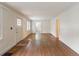 Open living room with bright white trim, hardwood floors, and a view to an adjacent room at 2129 Fairhaven Ne Cir, Atlanta, GA 30305