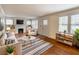 Bright living room with fireplace, hardwood floors and modern furniture at 2129 Fairhaven Ne Cir, Atlanta, GA 30305