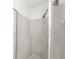 Shower featuring a shower head, silver trim, and glass door at 2129 Fairhaven Ne Cir, Atlanta, GA 30305