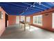 Unfinished basement featuring painted blue ceiling, a work table, and natural light at 2275 Barrett Dr, Cumming, GA 30040