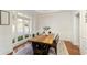 Elegant dining room with hardwood floors, wainscoting, and large window at 2275 Barrett Dr, Cumming, GA 30040