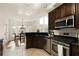Modern kitchen with granite counters, stainless steel appliances, and breakfast nook at 2275 Barrett Dr, Cumming, GA 30040