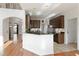 Kitchen features white cabinets, granite counters, and stainless steel appliances at 2275 Barrett Dr, Cumming, GA 30040