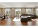 Open concept living room with large windows providing plenty of natural light and a view of the outdoors at 2275 Barrett Dr, Cumming, GA 30040