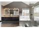 Serene bathroom with double vanity, soaking tub, and glass enclosed shower at 2275 Barrett Dr, Cumming, GA 30040