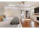 Spacious main bedroom featuring fireplace and hardwood floors at 2275 Barrett Dr, Cumming, GA 30040