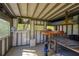 Inside the treehouse are bunkbeds and windows; fan on the ledge below the window at 2275 Barrett Dr, Cumming, GA 30040