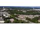 Aerial view of Atley Townhomes' location between Downtown Alpharetta and Avalon, surrounded by wooded areas and roads at 306 Atley Pl, Alpharetta, GA 30009