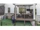 View of backyard patio with outdoor furniture, grill, and low maintenance artificial turf at 306 Atley Pl, Alpharetta, GA 30009
