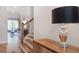 Home entryway featuring hardwood floors, stairs, and a view into the open living space at 306 Atley Pl, Alpharetta, GA 30009