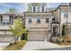 Charming two-story brick townhouse with a two-car garage and well-manicured landscaping at 306 Atley Pl, Alpharetta, GA 30009