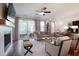 Spacious living room with a fireplace, modern decor, and sliding door to the patio at 306 Atley Pl, Alpharetta, GA 30009