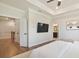 This spacious main bedroom provides hardwood floors, tray ceilings, and an ensuite bathroom at 306 Atley Pl, Alpharetta, GA 30009