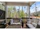 Inviting outdoor patio with cushioned seating perfect for enjoying the serene wooded views at 306 Atley Pl, Alpharetta, GA 30009